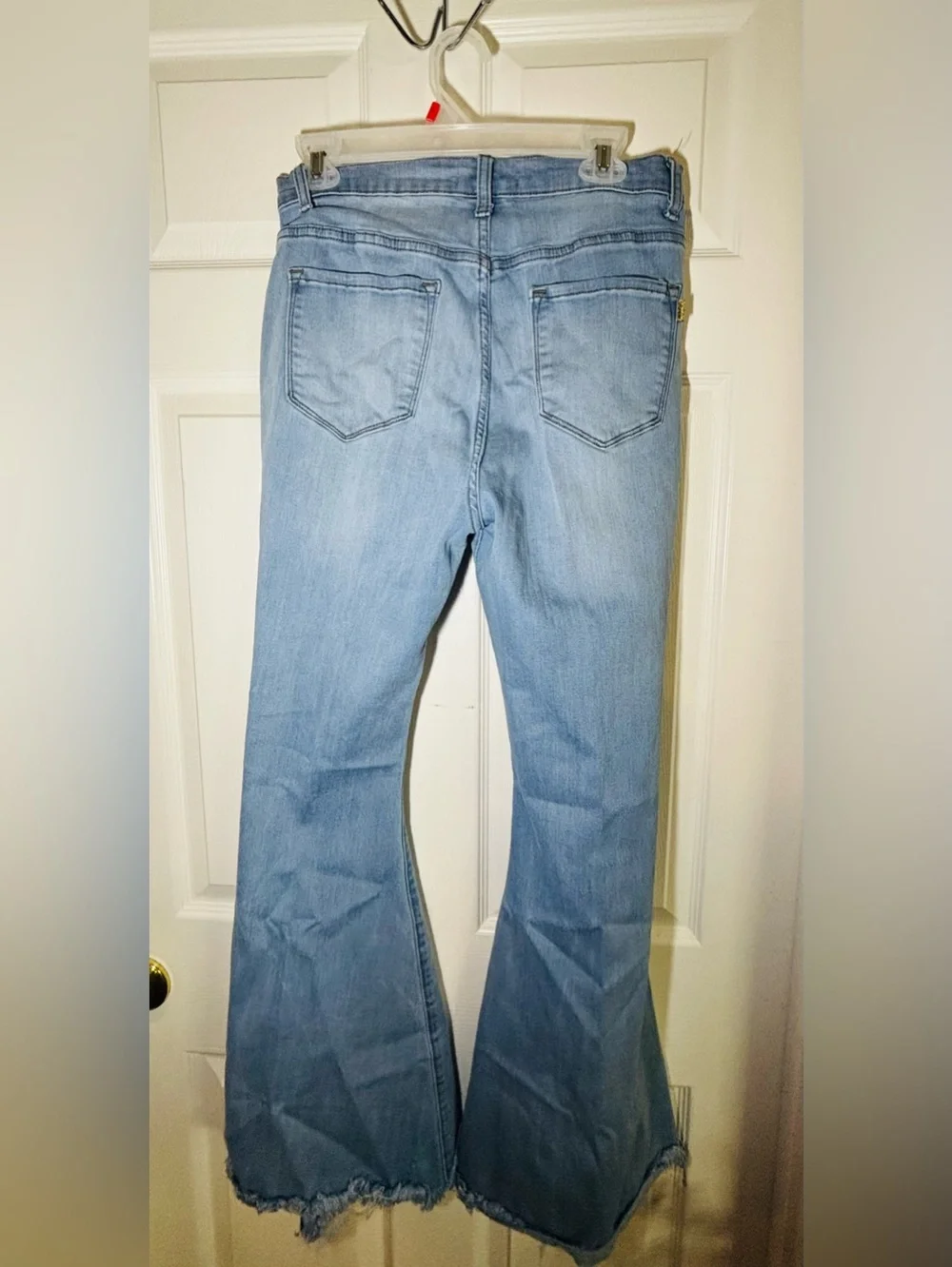 Vibrant light wash distressed flare jeans